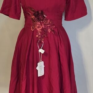 Elegant Red Dress with Floral Embellishment